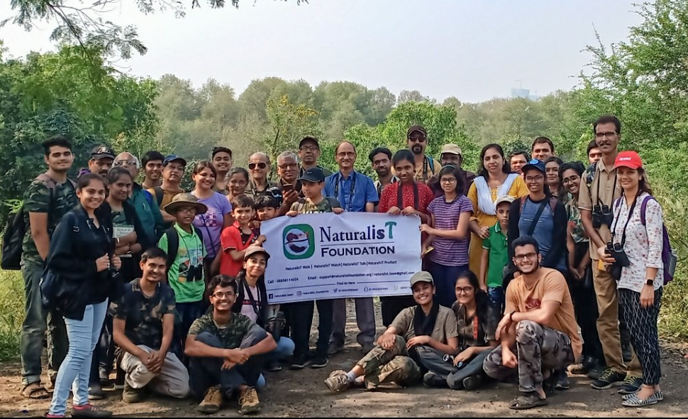 Explorers from all ages with binoculars attending a wildlife excursion near Bhandup Pumping Station