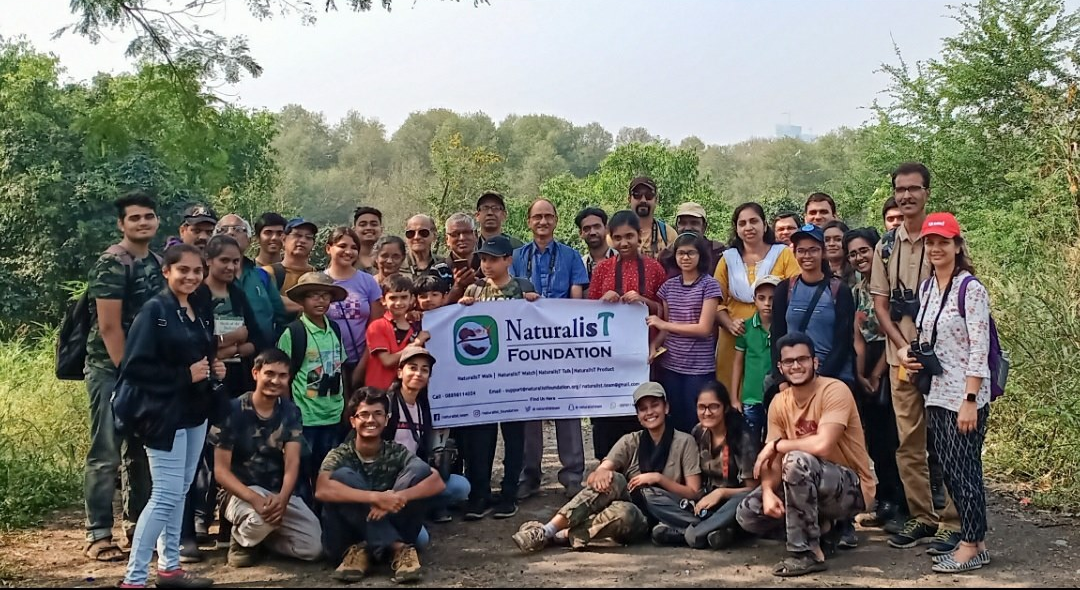 Explorers from all ages with binoculars attending a wildlife excursion near Bhandup Pumping Station