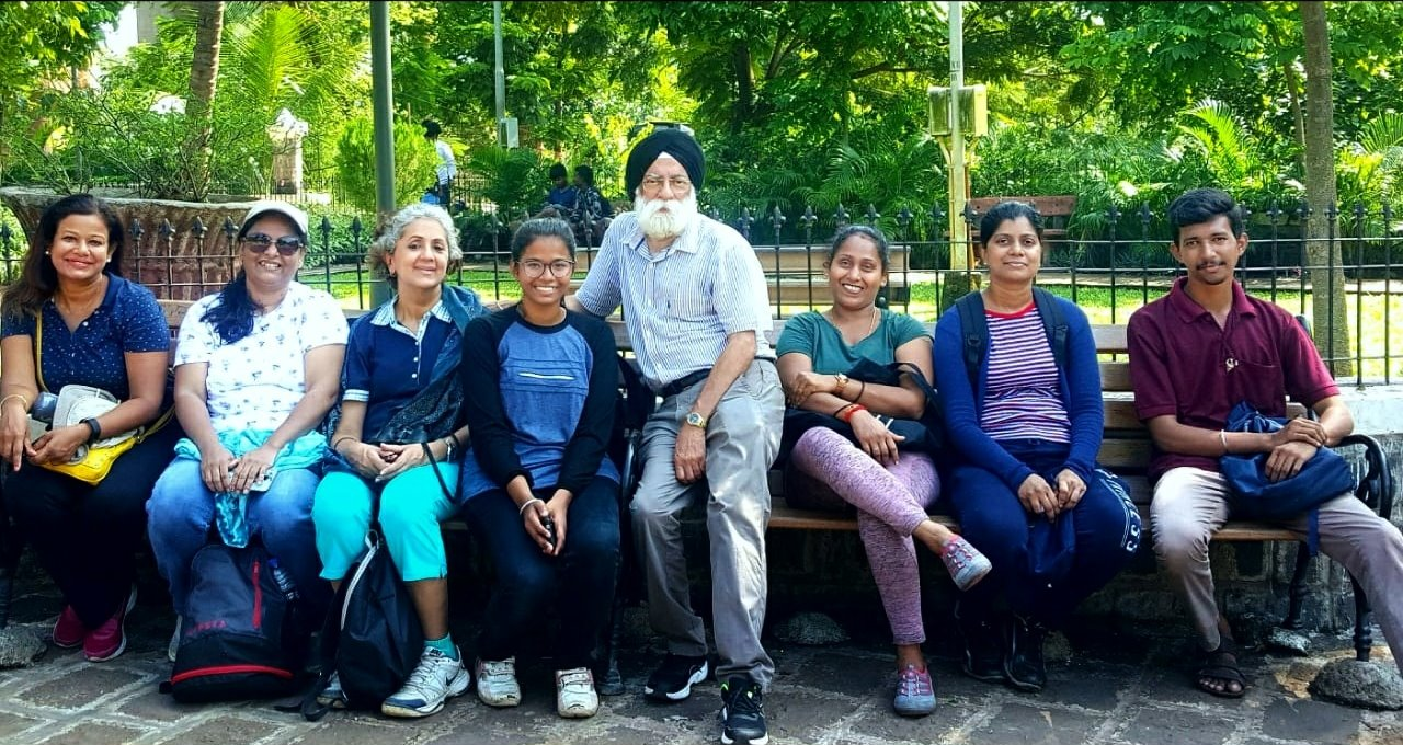People on a green city trail to Sion Fort posing for a photo