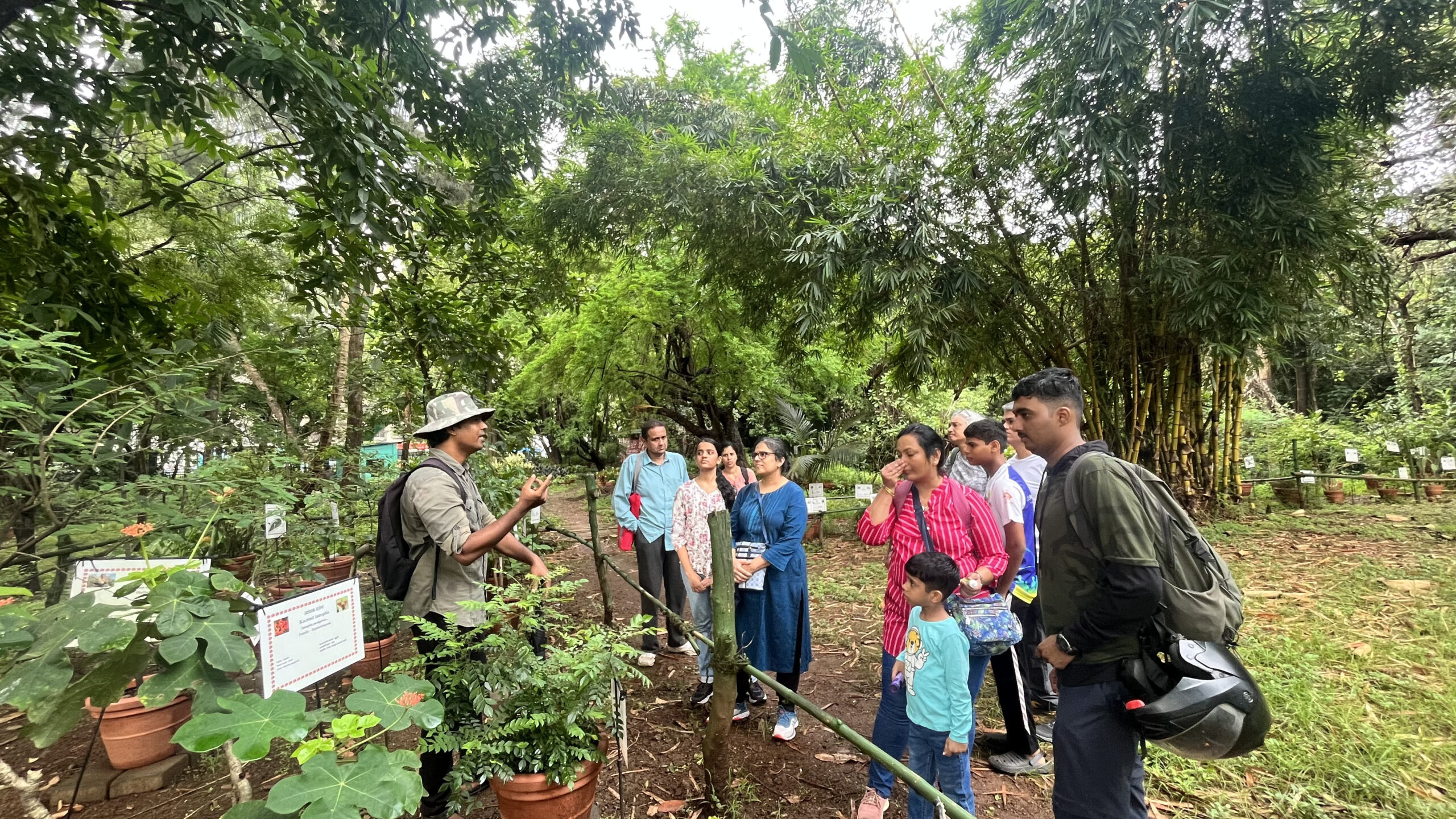 People being educated by the guide on a trail at the Maharashtra Nature Park