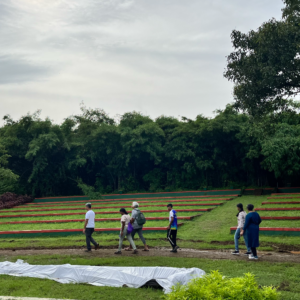 People walking across a path at the Maharashtra Nature park