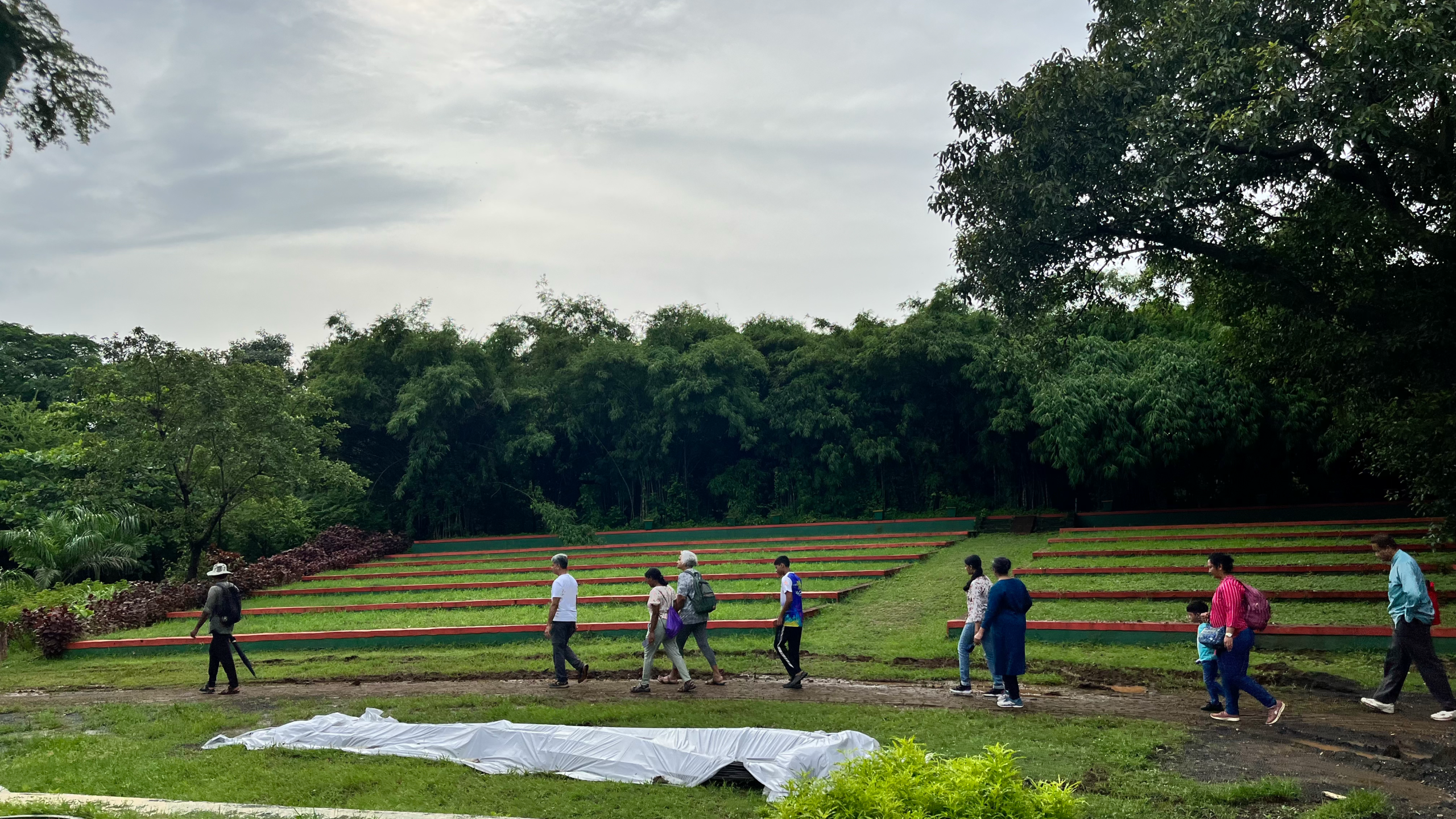People walking across a path at the Maharashtra Nature park
